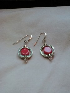 Earrings, silver w/antique oval and salmon colored stone. $15.00